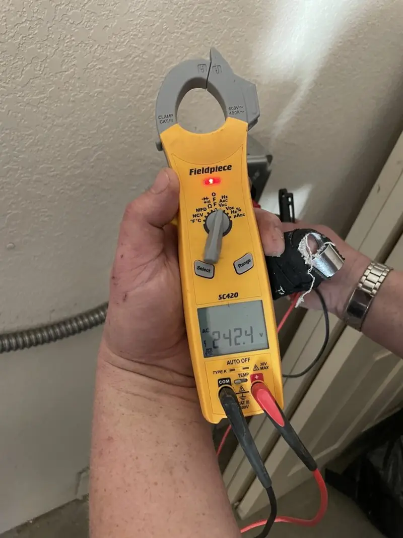 Voltage testing with clamp meter during Outlet Installation in Hitchcock